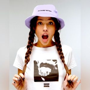 Olivia Rodrigo bucket hat “it’s brutal out here”